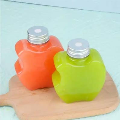 Custom clear 12oz apple shaped plastic juice bottles with caps from supplier