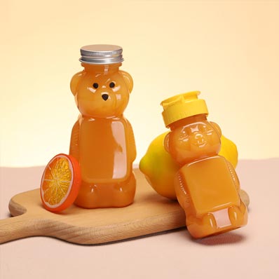 Wholesale custom size clear 250ml PET plastic bear juice bottles with caps