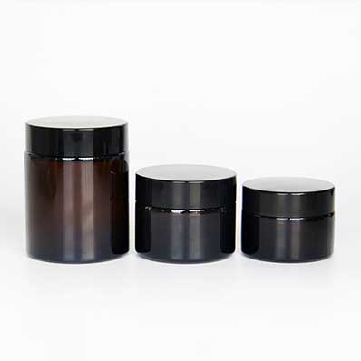 Wholesale 100ml amber glass cosmetic jars with black lids