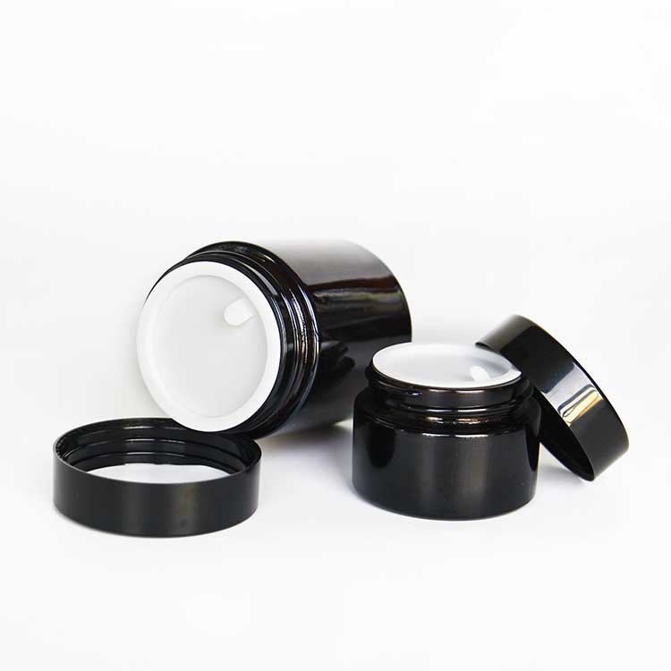 Wholesale 100ml amber glass cosmetic jars with black lids