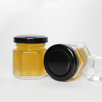 Hot selling clear 16oz  glass hexagon jars with gold twist off lids