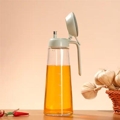 Wholesale clear 600ml glass kitchen oil bottle with dispenser cap