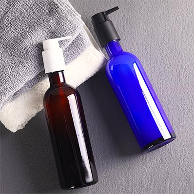 Wholesale 200ml amber/blue glass lotion bottle with pump and clip