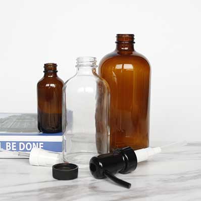 Refillable amber/clear 16oz glass lotion bottles with pump from supplier