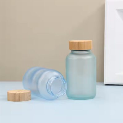 Wholesale 200ml matte blue glass vitamin supplement bottle luxury pill capsules bottle gummy container with wooden lid