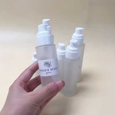 Wholesale refillable frosted 30ml glass treatment pump bottle for makeup foundation