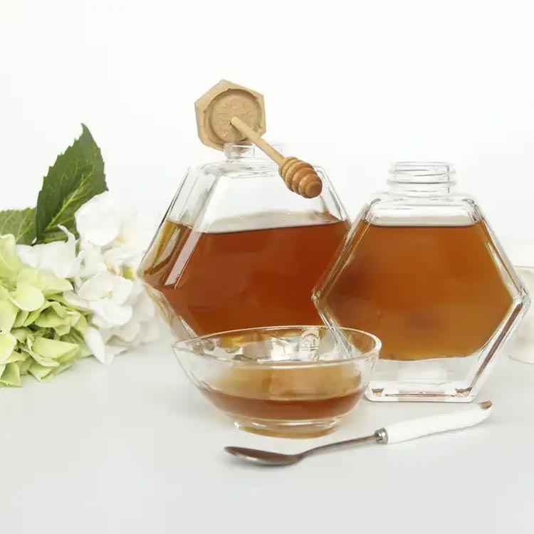 Bulk sale clear 500ml hexagon glass honey jar with dipper and lid