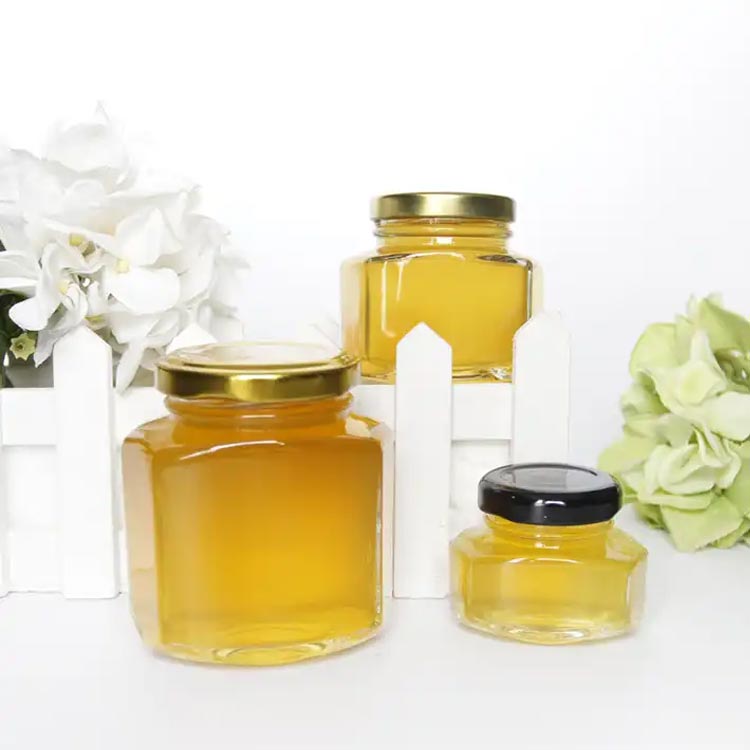 Wholesale clear 100ml glass hexagon honey jars with gold lids bulk