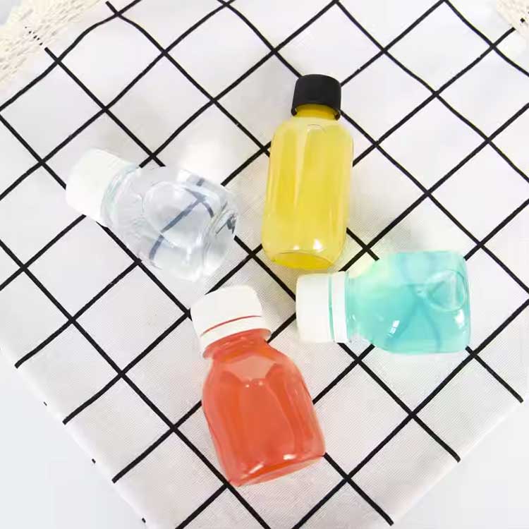 Food grade 2oz small shot bottles with lids, wholesale plastic ginger shot bottles with caps, 60ml mini liquor bottles, mini travel bottles for juice whiskey milk