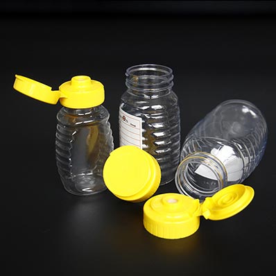 Food grade clear 8oz plastic queenline honey jars with dispensing caps