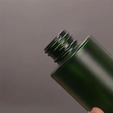 Wholesale 60ml frosted green glass toner pump bottle for skincare